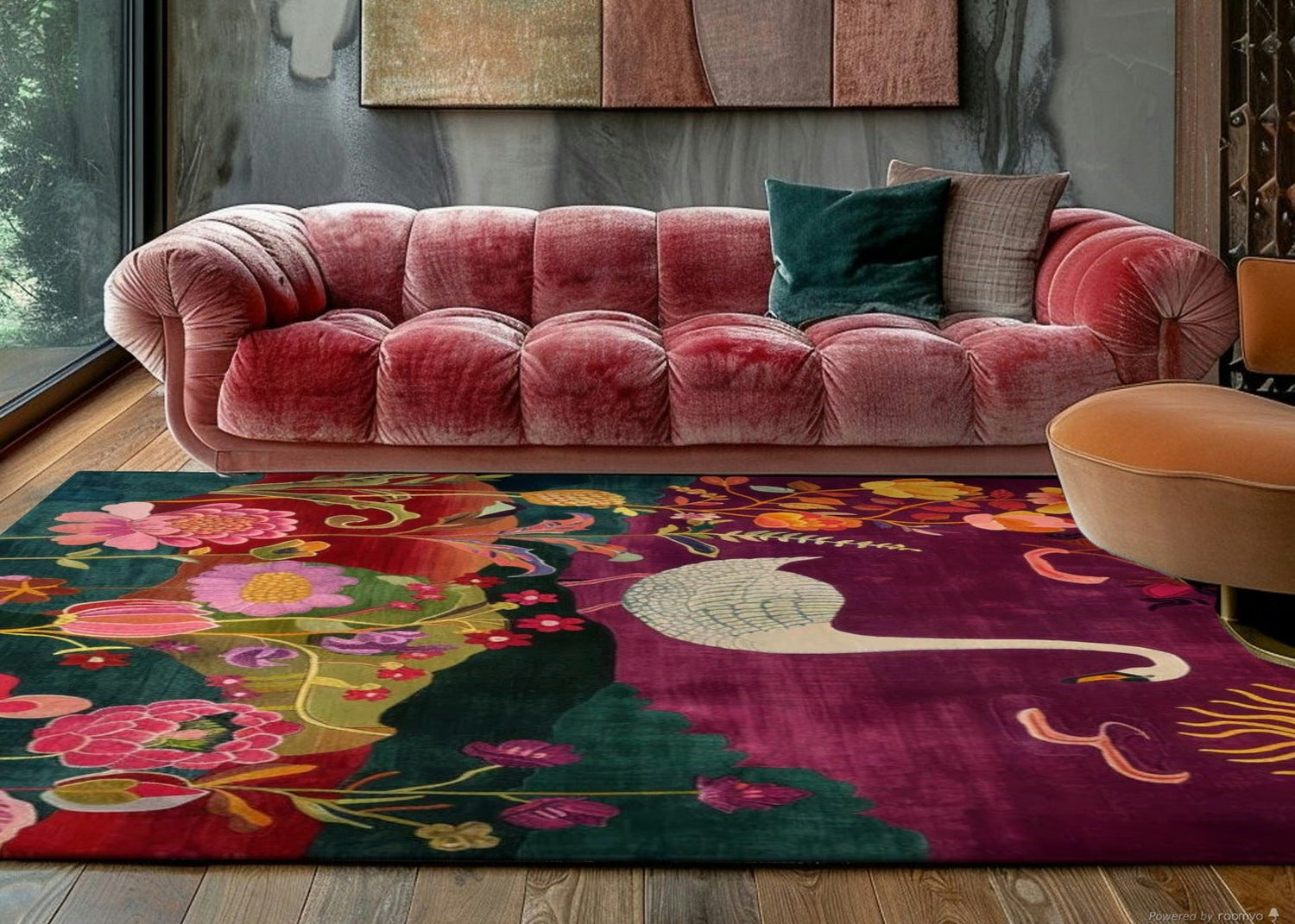 Pink sofa in a room with a colorful rug and abstract wall art