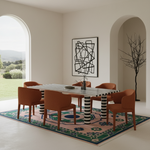 A modern dining room scene featuring a rectangular table with a black-and-white striped top and striped legs, surrounded by six terracotta-colored upholstered chairs on a patterned rug. The room has minimalist beige walls, arched windows showing a green lawn, and a black abstract wall art piece.