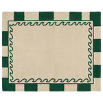 A rectangular cream-colored rug with a dark green border featuring alternating solid green and cream checkered stripes, and a dark green wavy decorative frame surrounding a large blank center.