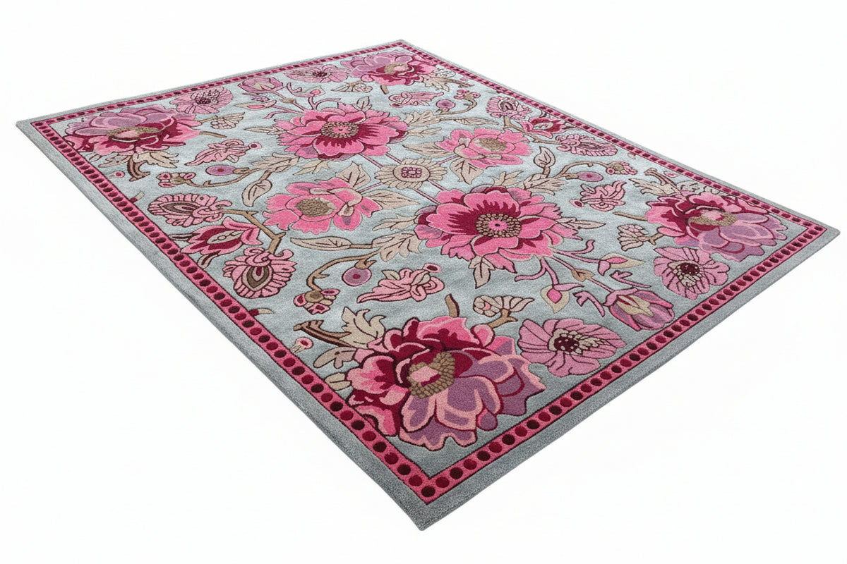 Floral patterned rug with pink flowers on a gray background