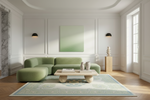 Modern living room with a green rug, sofa, coffee table, and rug.