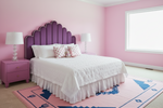 Pink bedroom with a purple headboard, white bedding, and floral curtains.