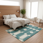 A modern bedroom scene with a teal and cream geometric patterned area rug on a light wood floor, styled with a wooden bed, white bedding, and a potted plant.