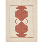 Rust-colored geometric pattern on a beige rug