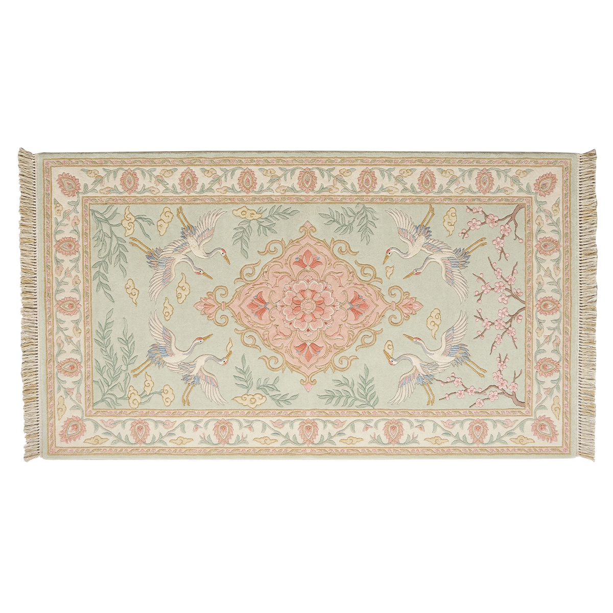 A rectangular woven rug with fringe on the short ends, featuring a pale sage green field, a central pink and gold medallion, two white cranes with blue accents, and floral motifs in the border.