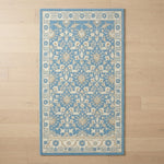 Cerulean Arabesque Vine Hand Tufted Wool Rug - studio photo