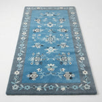 Cerulean Blossom Drift Hand Tufted Wool Rug - studio photo