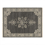 Charcoal Bloom Emblem Hand Knotted Rug - studio photo