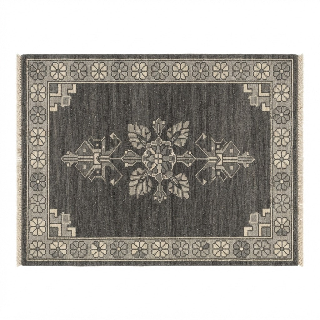 Charcoal Bloom Emblem Hand Knotted Rug - studio photo