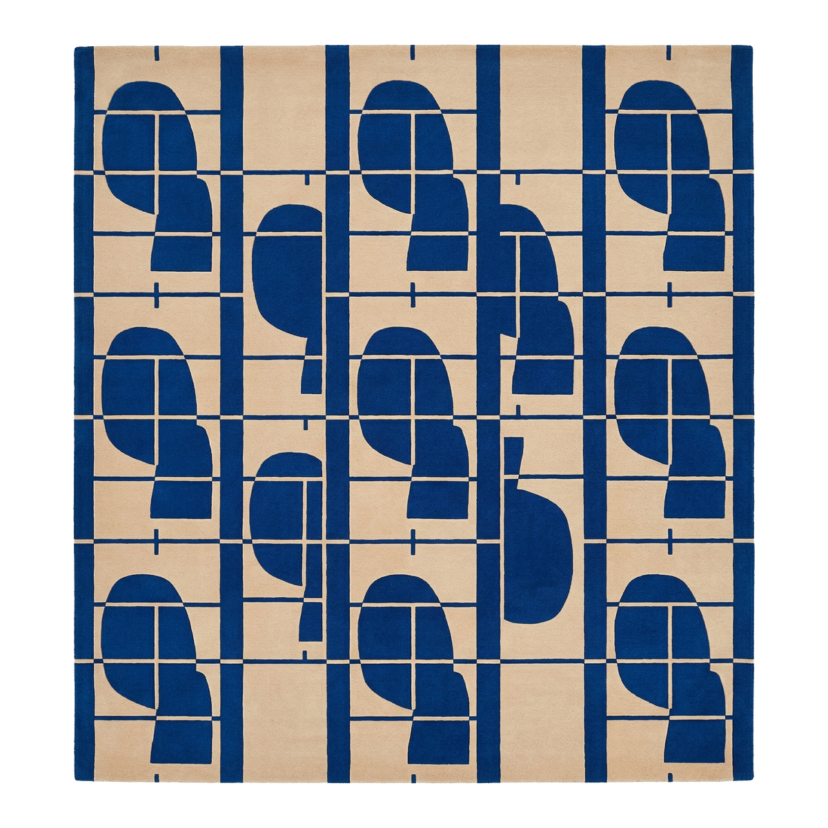 hand tufted wool rug with blue geometric pattern on beige background
