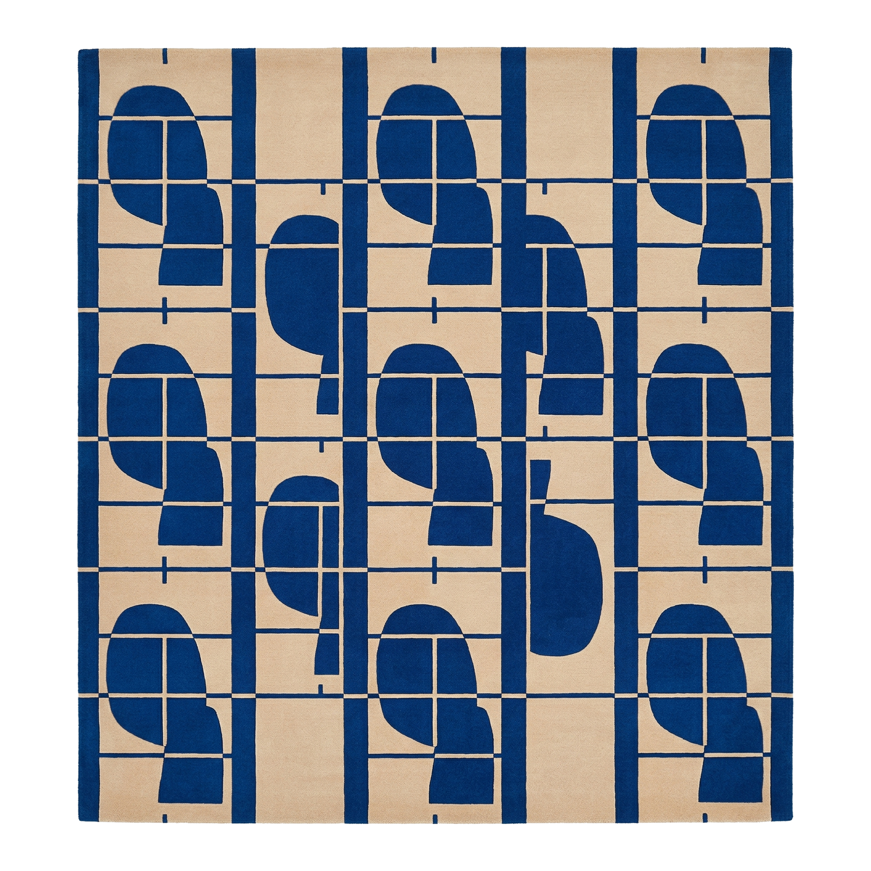 hand tufted wool rug with blue geometric pattern on beige background