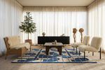 Modern living room with a blue and white patterned rug, wooden coffee table, and decorative chairs.