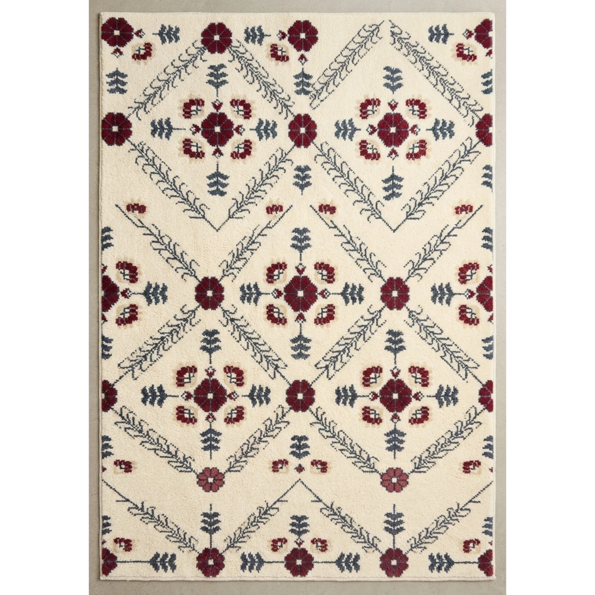 Crimson Chevron Garden Hand Tufted Wool Rug - studio photo