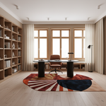 A modern home office with light wood floors, large windows, built-in shelving, a black desk, and a round area rug with a bold sunburst pattern in rust, cream, and navy.