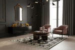 Modern living room with dark walls, a patterned rug, and decorative furniture.