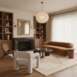 Modern living room with brown sofa, white chairs, shaggy rug, and wooden bookshelves.