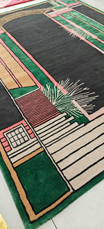 Decorative rug with geometric pattern on a white floor