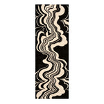 Abstract patterned rug with wavy lines on a black background