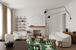 Modern living room with white furniture, green handmade rug, and decorative elements.
