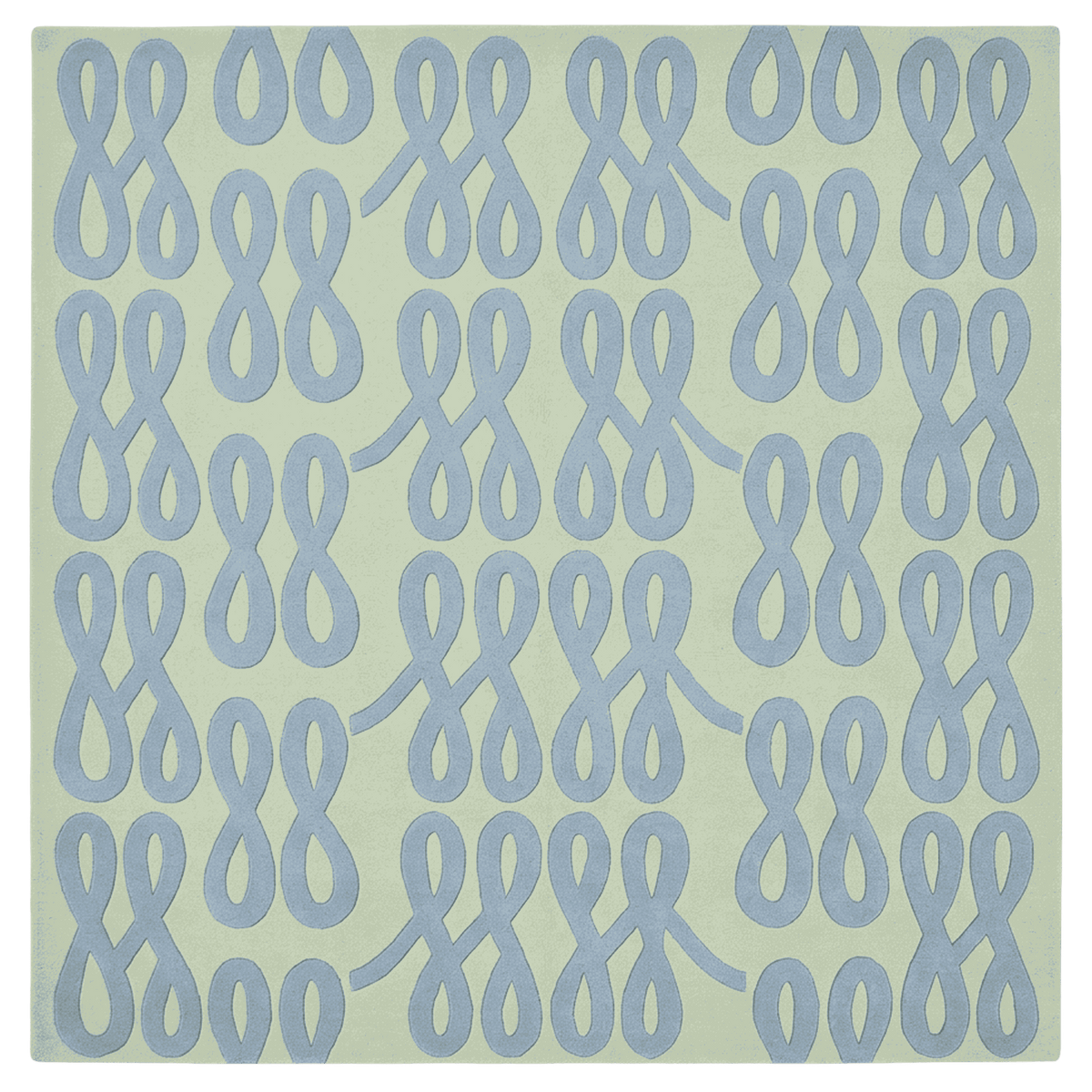 Pattern of blue interlocking shapes on a green rug