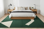 Bedroom with a wooden bed, white bedding, and a green geometric rug.