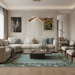 A modern living room featuring a large beige sectional sofa with light blue accent pillows, a dark wood coffee table, a light blue floral area rug, and elegant wall art on a beige paneled wall.