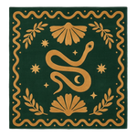 Decorative rug with a snake design on a green background