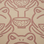 A close-up of a textured fabric or carpet featuring a repeating pattern of stylized frogs and bowls in dusty rose pink on a warm beige background.
