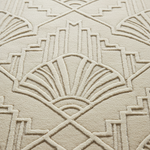 A close-up of a textured rug with a repeating Art Deco fan and geometric pattern in a warm cream or off-white tone.