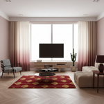 A modern living room with a red area rug featuring a gold geometric pattern, styled with a beige sofa, striped armchair, and a large flat-screen TV in front of a window with pink ombre curtains.