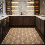 A large rectangular area rug with a repeating Art Deco fan pattern in beige and cream, styled in a modern U-shaped bar kitchen with dark wood cabinets and marble backsplash.