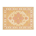 A rectangular area rug with a traditional Persian-style medallion pattern in soft cream, dusty pink, and ochre yellow, featuring small fringe on the top and bottom edges.