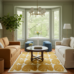 A styled living room interior with a mustard yellow and white patterned area rug, a round wooden coffee table, blue velvet stools, a chandelier, and large windows looking out to green trees.