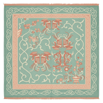 Decorative rug with intricate patterns on a light blue background