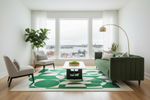 Modern living room with green sofa, green patterned rug, and city view