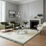 Modern living room with green chairs, shaggy rug, a glass coffee table, and a fireplace.