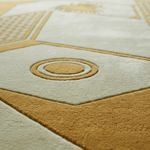 Close-up of the cream and gold Art Deco pattern on the Hollywood Peak rug