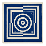 Blue and white geometric patterned rug on a white background