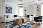 Modern living room with white sofa, blue rug, accent chair, and decorative elements.