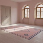 A large rectangular area rug with a pink base, blue geometric border and diamond motifs, and dark fringe, shown in a sunlit room with pale pink walls, light wood floors, and two arched windows.