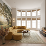 A modern living room featuring a mustard yellow modular sectional sofa with matching ottoman, set on a large patterned area rug in front of a bay window and next to a fireplace.