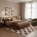 A modern bedroom featuring a low-profile platform bed with a brown upholstered frame, styled with neutral beige and brown bedding, a patterned rug, and a contemporary brass chandelier.