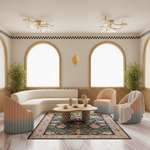 A beautifully styled modern living room featuring a curved cream sofa, two pastel ombre armchairs, a round wooden coffee table, and a colorful patterned area rug. The room has arched windows with gold frames, a checkered border, and gold ceiling lights.