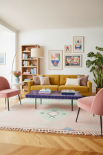 Modern living room with yellow sofa, pink rug, and colorful decor