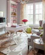 Modern home office with pink ceiling, white desk, and pink sofa.