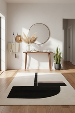 Modern interior with a contemporary rug, console table, and decorative items.
