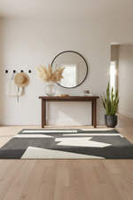 Modern interior with a contemporary rug, console table, and decorative items.