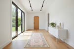 pink runner rug in hallway
