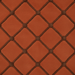 A close-up of a textured terracotta orange fabric with a dark brown diamond lattice pattern and raised button details.