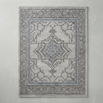 Pewter Labyrinth Crest Hand Tufted Wool Rug - studio photo